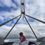 Abby on the roof looking at the flag