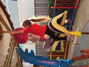 Abby on the Merry Go Round at Movie World