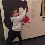 Abby demonstrating how to hold a Cricket Bat at the Bradman Museum in Bowral