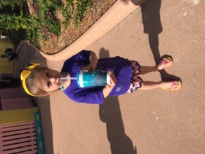 Abby drinking Lemonade from a big cup at Sea World