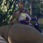 Abby and Aiden on a statue at Currumbin Wildlife Sanctuary