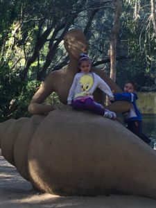 Abby and Aiden on a statue at Currumbin Wildlife Sanctuary